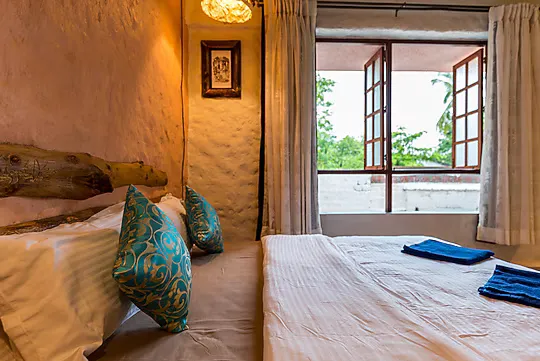 Reclaimed timber headboard in the Honeymoon Villa